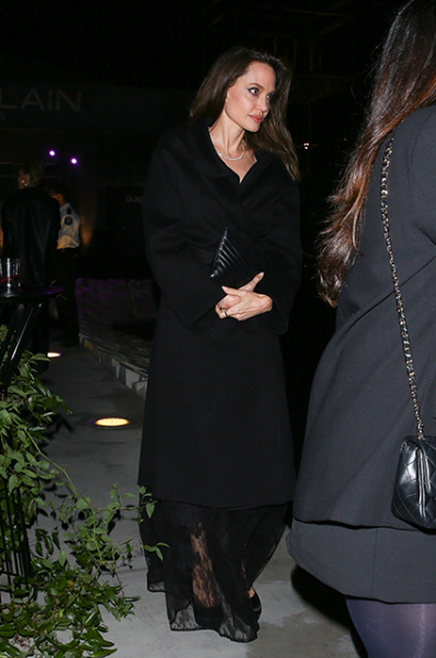 Angelina Jolie in the image of total black attended the gala evening in Los Angeles